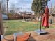Backyard deck furnished with chairs and lounge chairs and firepit seating for outdoor enjoyment at 1519 S Lowell Blvd, Denver, CO 80219