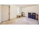 Spacious bonus room with neutral carpet, an adjacent closet, and play area with toy kitchen set at 1519 S Lowell Blvd, Denver, CO 80219