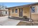Welcoming front porch with decorative details, creating a charming entry to the home at 1519 S Lowell Blvd, Denver, CO 80219