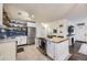 Bright kitchen with modern stainless-steel appliances and a functional island at 1519 S Lowell Blvd, Denver, CO 80219