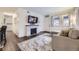 Bright living room with a decorative fireplace and a comfortable seating area at 1519 S Lowell Blvd, Denver, CO 80219
