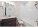 Bathroom with a modern vanity, toilet, and shower-tub combination at 1263 Rhett Dr, Erie, CO 80026