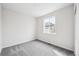 Bright bedroom with a window, neutral paint, and carpeted floors at 1263 Rhett Dr, Erie, CO 80026