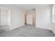 Spacious carpeted bedroom with neutral walls and bright open doorways at 1263 Rhett Dr, Erie, CO 80026