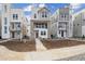 Newly constructed two-story home featuring modern architecture and a well-manicured front yard at 1263 Rhett Dr, Erie, CO 80026