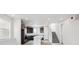 Modern kitchen with dark wood cabinets, an island, and stainless steel appliances at 1263 Rhett Dr, Erie, CO 80026
