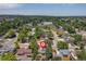 Aerial view of a home with mature trees in a quiet neighborhood at 7046 W 62Nd Pl, Arvada, CO 80003