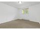A finished basement with neutral carpet and one window at 7046 W 62Nd Pl, Arvada, CO 80003