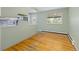 Inviting dining area with hardwood floors, a large window, and easy access to the kitchen, perfect for casual meals at 7046 W 62Nd Pl, Arvada, CO 80003