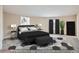 Stylish bedroom with neutral colors, a patterned rug, and modern furniture at 8100 W Quincy Ave # D, Littleton, CO 80123