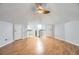 Spacious bonus room featuring vaulted ceilings, a modern ceiling fan and wood laminate flooring at 8100 W Quincy Ave # D, Denver, CO 80123