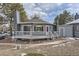 Cozy home featuring a deck, and landscaped front yard at 8100 W Quincy Ave # D, Littleton, CO 80123