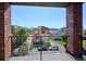 Brick balcony view showcasing the city skyline, a nearby stadium, and modern architecture at 1819 N Grove St, Denver, CO 80204