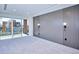 Bright bedroom with a sliding glass door leading to a balcony and modern wall sconces at 1819 N Grove St, Denver, CO 80204