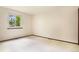 Empty bedroom features neutral carpet, a window providing natural light, and fresh paint at 7582 S Newport Ct, Centennial, CO 80112