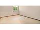 Empty bedroom features neutral carpet, a window providing natural light, and fresh paint at 7582 S Newport Ct, Centennial, CO 80112
