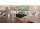 Bright living room with hardwood floors, large windows, and contemporary furniture at 7582 S Newport Ct, Centennial, CO 80112