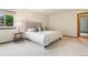 Bright bedroom features soft carpet, neutral wall colors, and a large window offering views at 7582 S Newport Ct, Centennial, CO 80112
