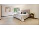 Spacious bedroom with soft carpet, large windows, a neutral color palette, and natural light at 7582 S Newport Ct, Centennial, CO 80112