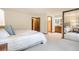 Open primary bedroom leads to bathroom and closet, enhanced with soft carpet and natural light at 7582 S Newport Ct, Centennial, CO 80112