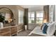 Bright bedroom with neutral tones, large windows, and stylish furniture, perfect for relaxing at 39733 Penn Rd, Elizabeth, CO 80107