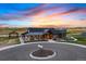 Beautiful building with welcoming entrance, surrounded by lush landscaping and convenient circular driveway for easy access at 39733 Penn Rd, Elizabeth, CO 80107