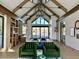 Lobby featuring soaring ceilings with wood beams and a seating area at 39733 Penn Rd, Elizabeth, CO 80107