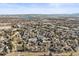 Expansive aerial shot of the neighborhood with multiple bodies of water in the background at 10588 E Park Mtn, Littleton, CO 80127