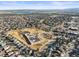 Scenic aerial view of the community with a lake and school in the background at 10588 E Park Mtn, Littleton, CO 80127