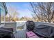 A view of the wooden back deck with a grill and outdoor seating at 10588 E Park Mtn, Littleton, CO 80127