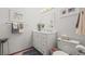 Clean, well-lit bathroom featuring a white vanity and ample lighting at 10588 E Park Mtn, Littleton, CO 80127
