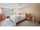 Bright bedroom featuring cozy decor, neutral walls, and a scenic window view at 10588 E Park Mtn, Littleton, CO 80127