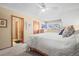 Inviting bedroom with natural light, soft carpet, and ensuite bathroom entrance at 10588 E Park Mtn, Littleton, CO 80127