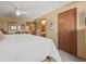 A relaxing bedroom featuring light walls, plush carpets, and an ensuite bathroom at 10588 E Park Mtn, Littleton, CO 80127