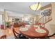 Open layout connects dining area to living room with hardwood floors and natural light at 10588 E Park Mtn, Littleton, CO 80127