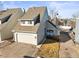Charming townhome featuring a two-car garage and inviting front patio area at 10588 E Park Mtn, Littleton, CO 80127