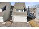 Charming home with a gray roof, attached garage, and well-maintained landscaping in a peaceful neighborhood at 10588 E Park Mtn, Littleton, CO 80127