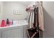 Functional laundry room with washer, dryer, and convenient overhead storage for organization at 10588 E Park Mtn, Littleton, CO 80127