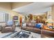 Spacious living room featuring hardwood floors, comfortable seating, and an open layout at 10588 E Park Mtn, Littleton, CO 80127