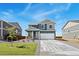 Beautiful two-story home with a two car garage, stone accents and a well manicured lawn at 2233 Base St, Fort Lupton, CO 80621