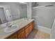 Bathroom with double vanity, shower, and tile flooring at 6415 Raleigh St, Arvada, CO 80003