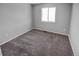 Simple bedroom with gray walls and carpet flooring at 6415 Raleigh St, Arvada, CO 80003