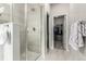Elegant bathroom with a glass shower and walk-in closet at 5187 S Fairplay St, Aurora, CO 80015