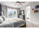 A comfortable bedroom with balcony access and bathroom views at 5187 S Fairplay St, Aurora, CO 80015