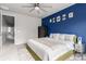Spacious bedroom featuring a ceiling fan, modern decor and a large bed at 5187 S Fairplay St, Aurora, CO 80015