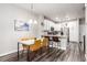 Well-lit kitchen and dining area, perfect for everyday dining or entertaining guests at 5187 S Fairplay St, Aurora, CO 80015
