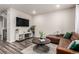 Inviting living room with stylish furnishings and hardwood flooring at 5187 S Fairplay St, Aurora, CO 80015