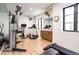 Well-equipped home gym with various exercise machines at 673 S Gaylord St, Denver, CO 80209