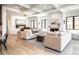 Bright living room with hardwood floors, comfy sofas, and a fireplace at 673 S Gaylord St, Denver, CO 80209