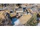 Aerial view of a home, fenced backyard, covered patio, mature trees, and neighborhood, providing a picturesque landscape at 6940 S Uinta St, Centennial, CO 80112